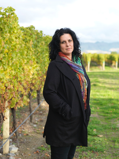 Siobhan Wilson standing in a vineyard