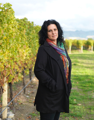 Siobhan Wilson standing in a vineyard