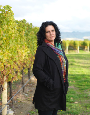 Siobhan Wilson standing in a vineyard