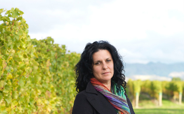 Siobhan Wilson standing in a vineyard