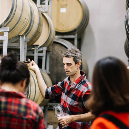 Dom Maxwell infront of a crowd