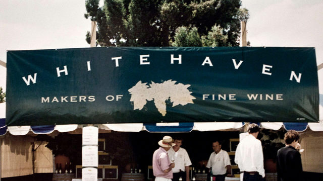 Whitehaven banner on a stall with people