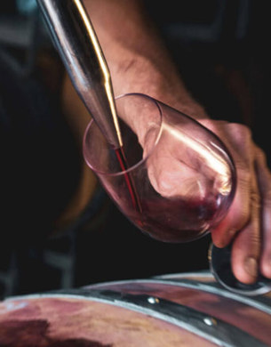 Pinot Noir being poured into a glass.