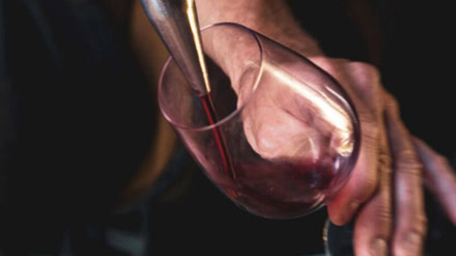 Pinot Noir being poured into a glass.