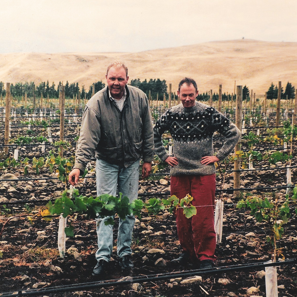 Lindsey Hill and Paul Tutton standing in a vineyard