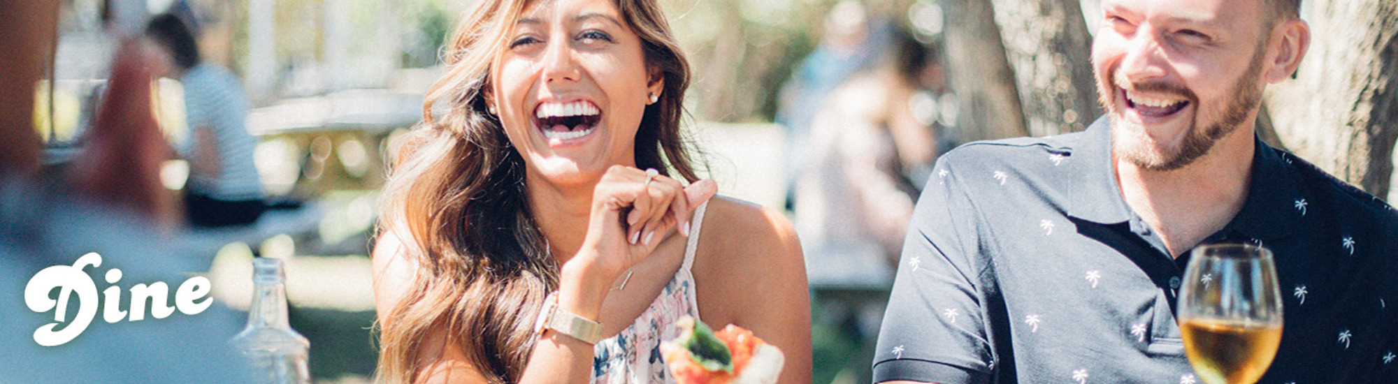 People dining in a vineyard