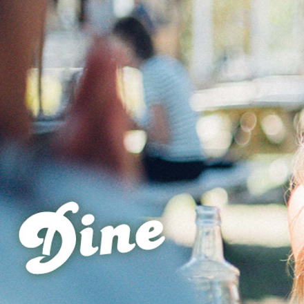 People dining in a vineyard