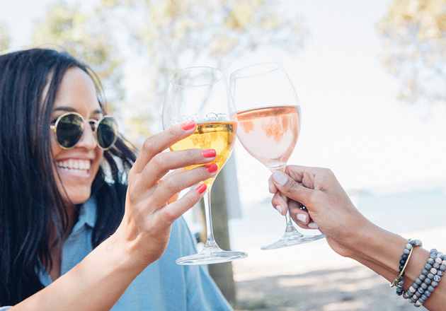 Woman raising wine glass