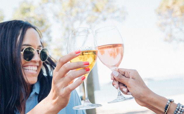 Woman raising wine glass