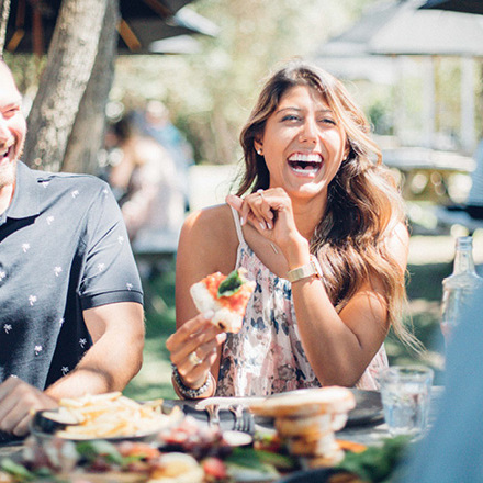 People laughing at a vineyard restaurant