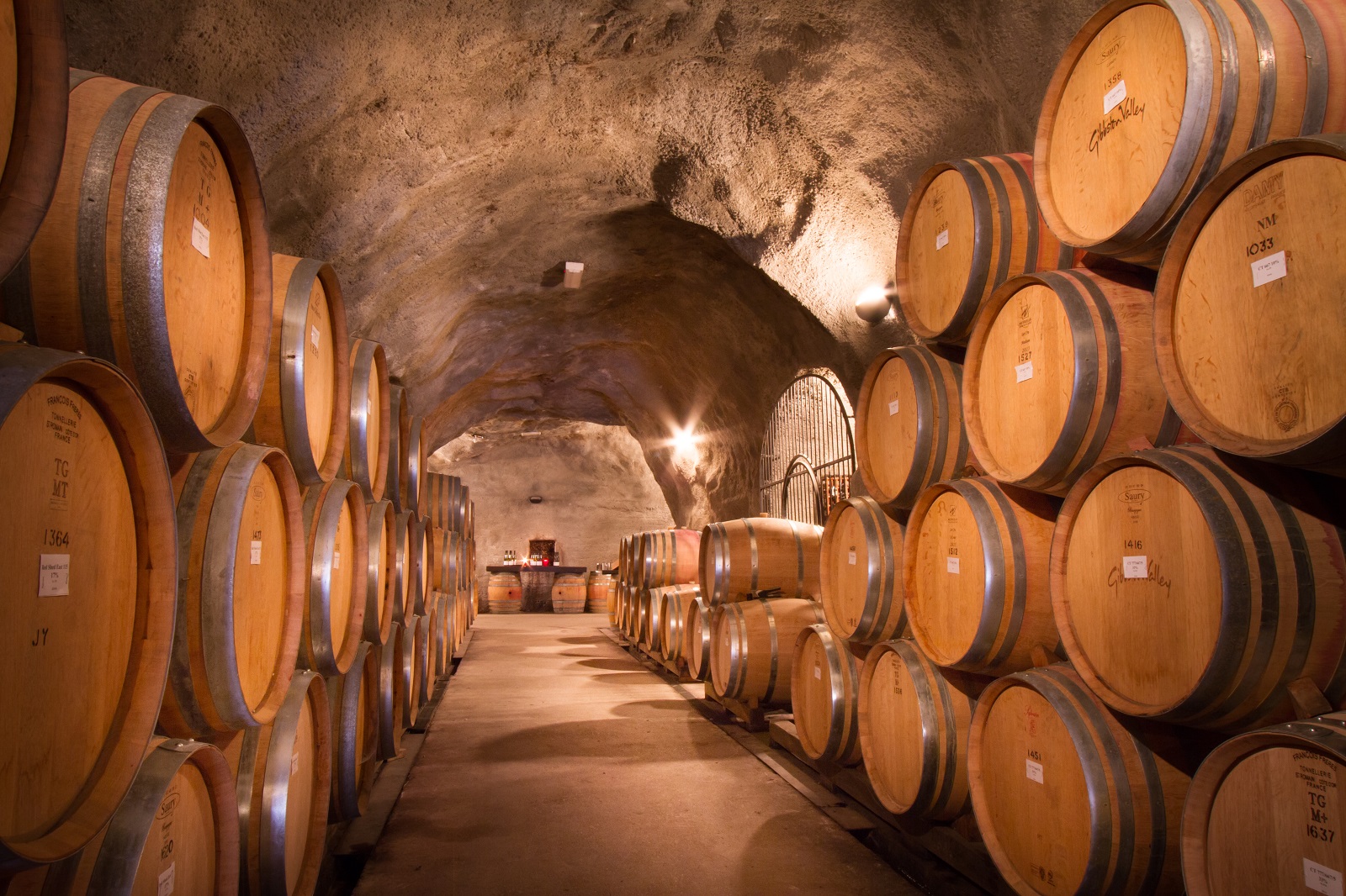 Stacked wine barrels in the cave at Gibbston Valley Cave, Central Otago.